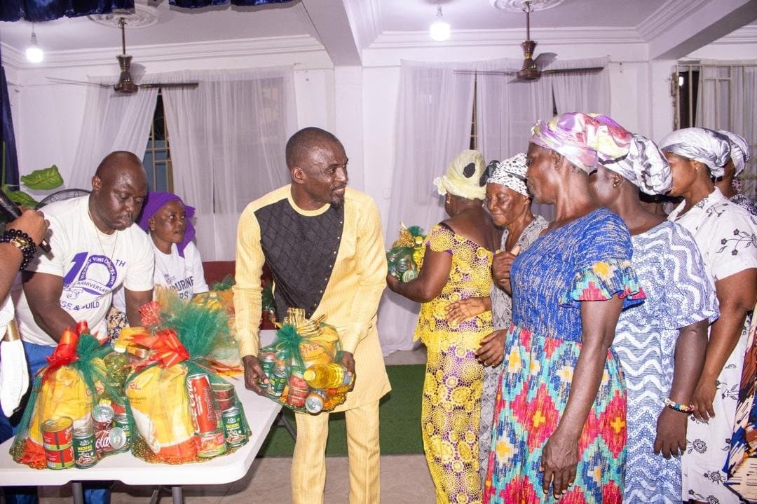 Foundation team handing care packages to elderly community members